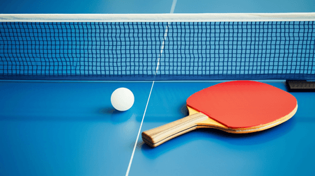 创意乒乓球比赛奥运会球拍球网和乒乓球背景