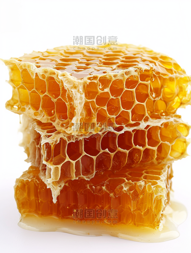 创意蜂蜜蜂巢在白色背景上餐饮美食食材
